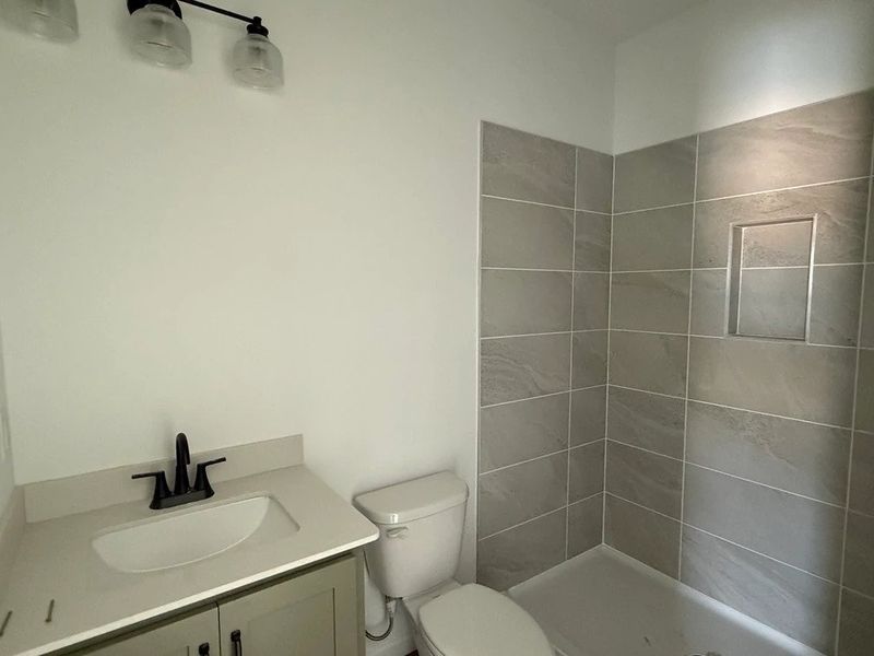 Guest Bath featuring the AW Collection® Rosemary - Garden hues and clean finishes invite calm.