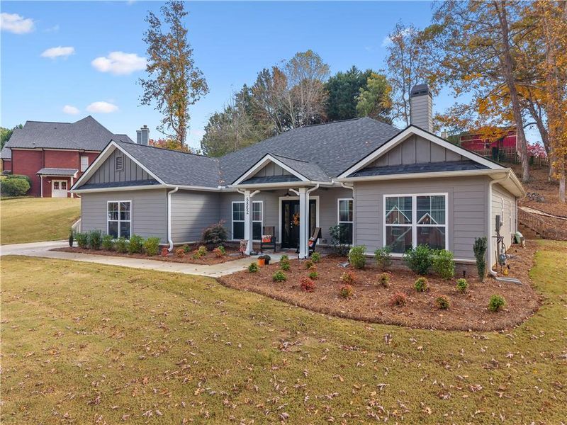 Front exterior of a new home in Holiday Pines, Buford, GA, highlighting curb appeal (Image 21).