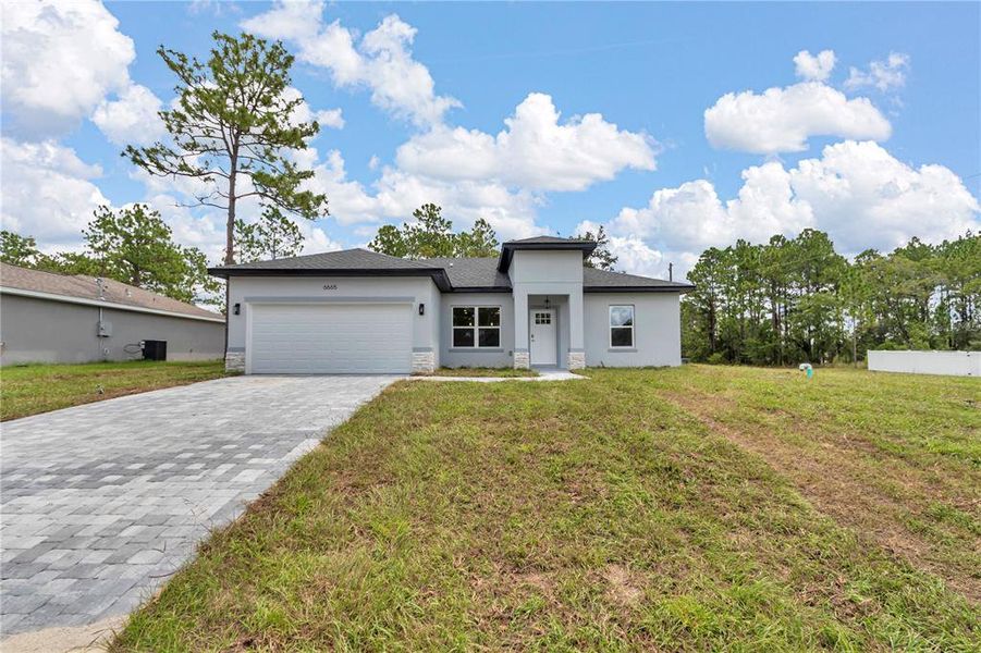 Front exterior of a new home in , Citrus Springs, FL, highlighting curb appeal (Image 20).