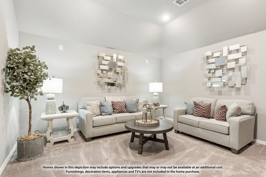 Living room with beige sofa and loveseat, round wood coffee table, and decorative wall art on carpet Living room with beige sofa and loveseat, round wood coffee table, and decorative wall art on carpet
