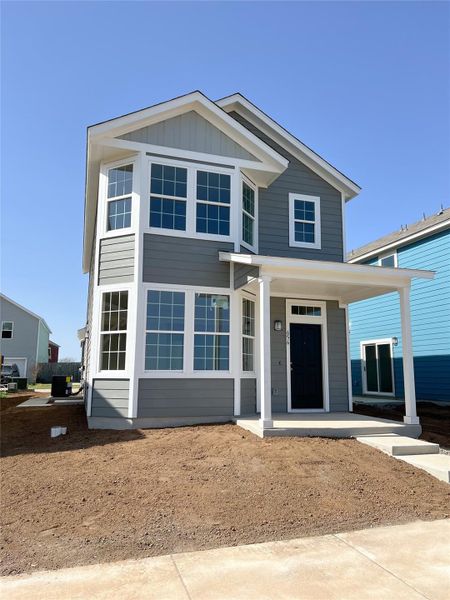 View of front facade with cooling unit and board and batten siding View of front facade with cooling unit and board and batten siding