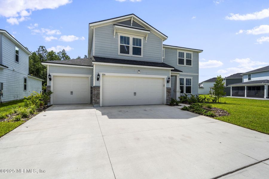 Front exterior of a new home in , Middleburg, FL, highlighting curb appeal (Image 2). Front exterior of a new home in , Middleburg, FL, highlighting curb appeal (Image 2).