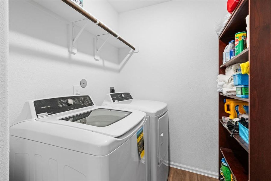 Great laundry room with overhead storage