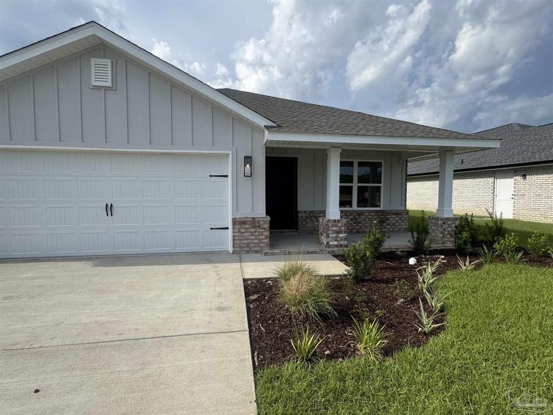 Front exterior of a new home in Hidden Pines Estates, Milton, FL, highlighting curb appeal (Image 1). Front exterior of a new home in Hidden Pines Estates, Milton, FL, highlighting curb appeal (Image 1).