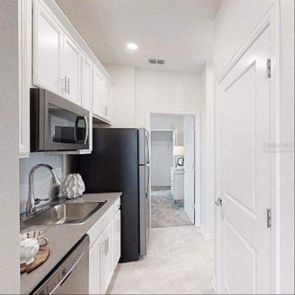 Furnished interior view inside a new home in Wynnstone, Davenport (Image 7).