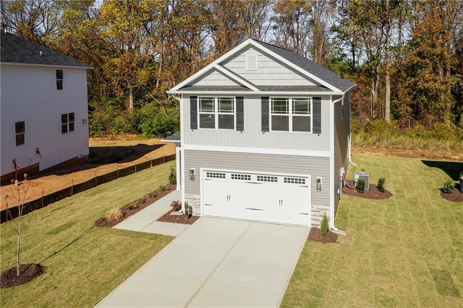 Front exterior of a new home in Magnolia Villas, Cornelia, GA, highlighting curb appeal (Image 1). Front exterior of a new home in Magnolia Villas, Cornelia, GA, highlighting curb appeal (Image 1).