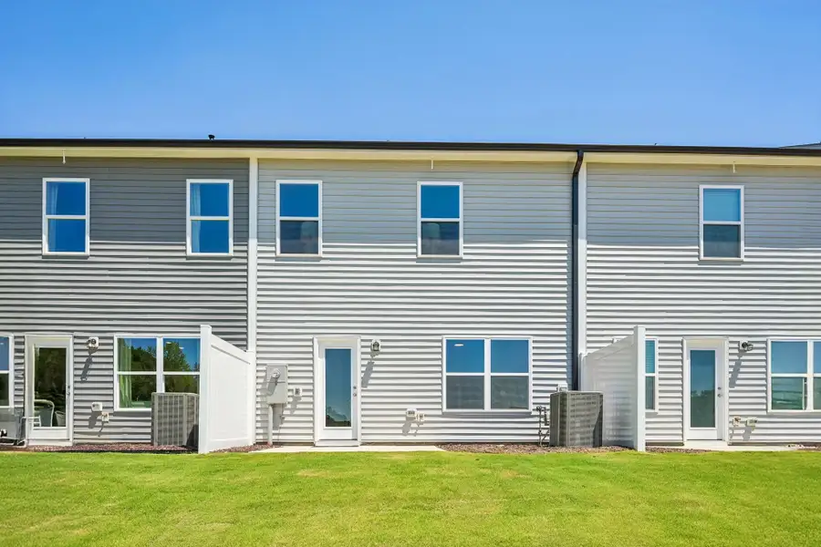Exterior details and patio area of a home in Towns at Crescent Mills, Wilson's Mills (Image 3).