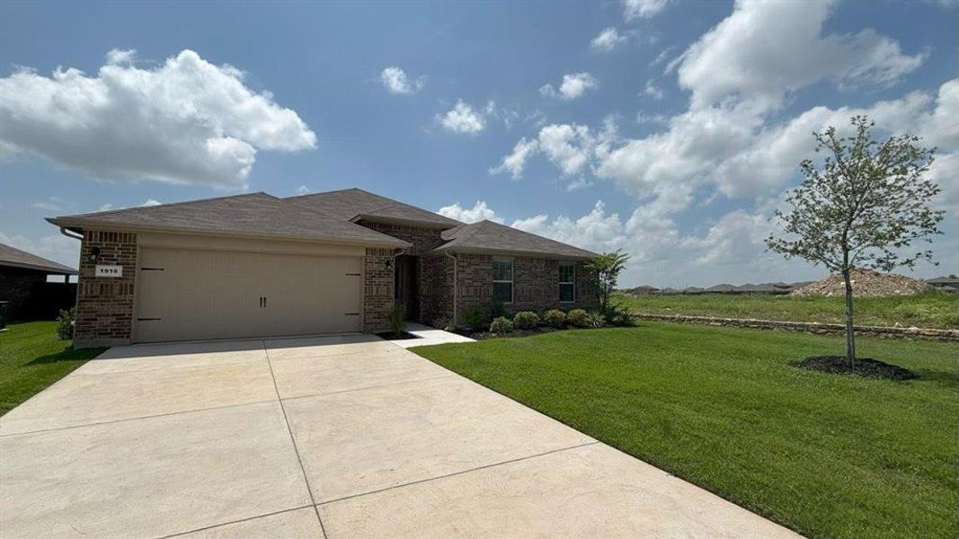Front exterior of a new home in Legado, Cleburne, TX, highlighting curb appeal (Image 2).