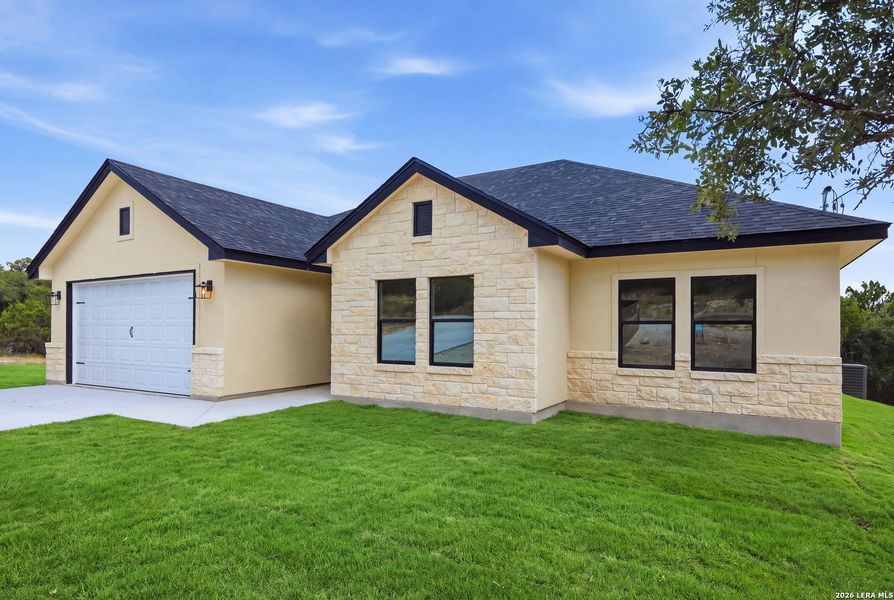 Front exterior of a new home in , Fischer, TX, highlighting curb appeal (Image 28). Front exterior of a new home in , Fischer, TX, highlighting curb appeal (Image 28).