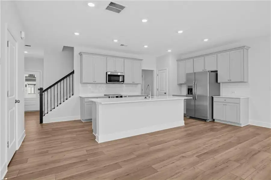 Furnished interior view inside a new home in Towns at Holly Springs, Holly Springs (Image 7).
