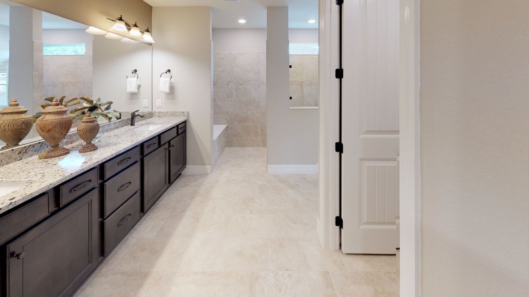 Owners Bathroom with Dual Sinks and Walk-In Shower