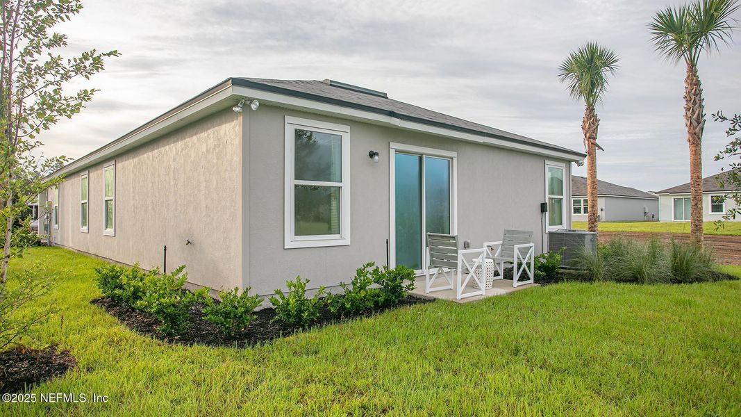 Exterior details and patio area of a home in Grand Reserve, Bunnell (Image 3).