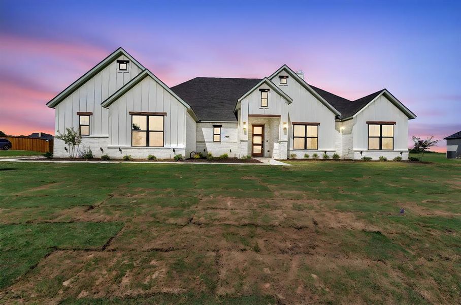 Front exterior of a new home in , Waxahachie, TX, highlighting curb appeal (Image 2).