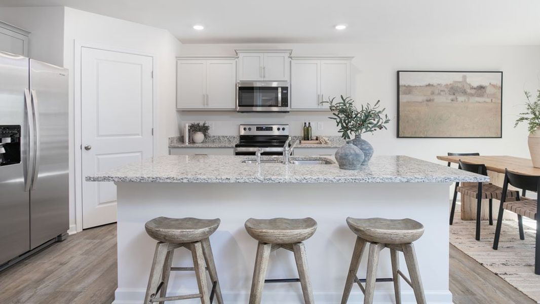 Representative furnished interior of a home built from the HAYDEN by D.R. Horton in River's Edge, Mayodan (Image 27).