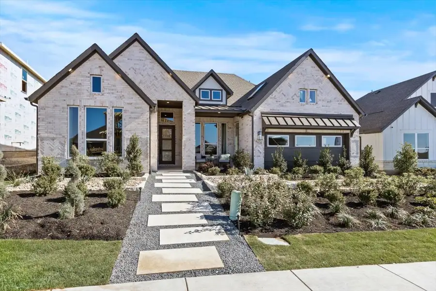 Front exterior of a new home in Berry Creek Highlands, Georgetown, TX, highlighting curb appeal (Image 2). Front exterior of a new home in Berry Creek Highlands, Georgetown, TX, highlighting curb appeal (Image 2).