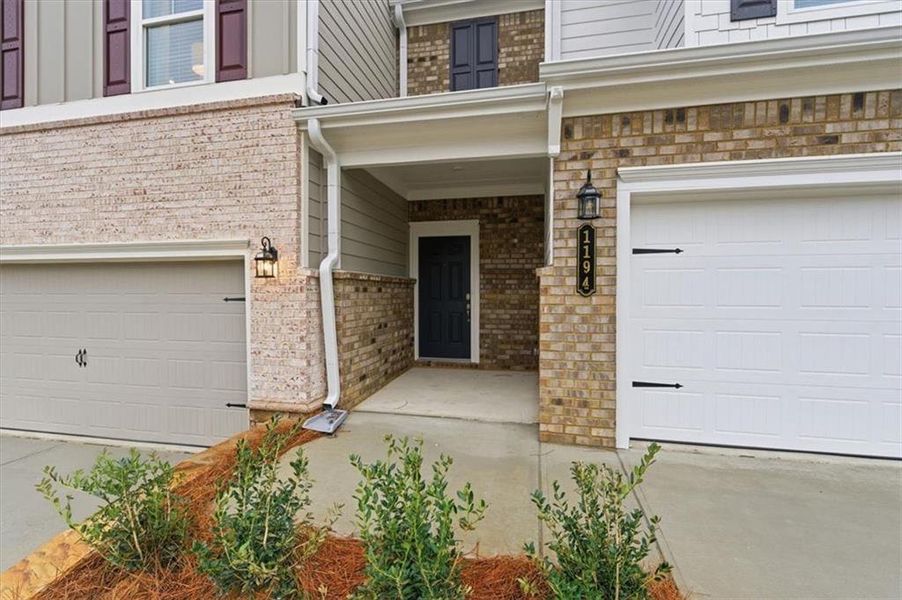 Exterior details and patio area of a home in Park Center Pointe, Mableton (Image 21).