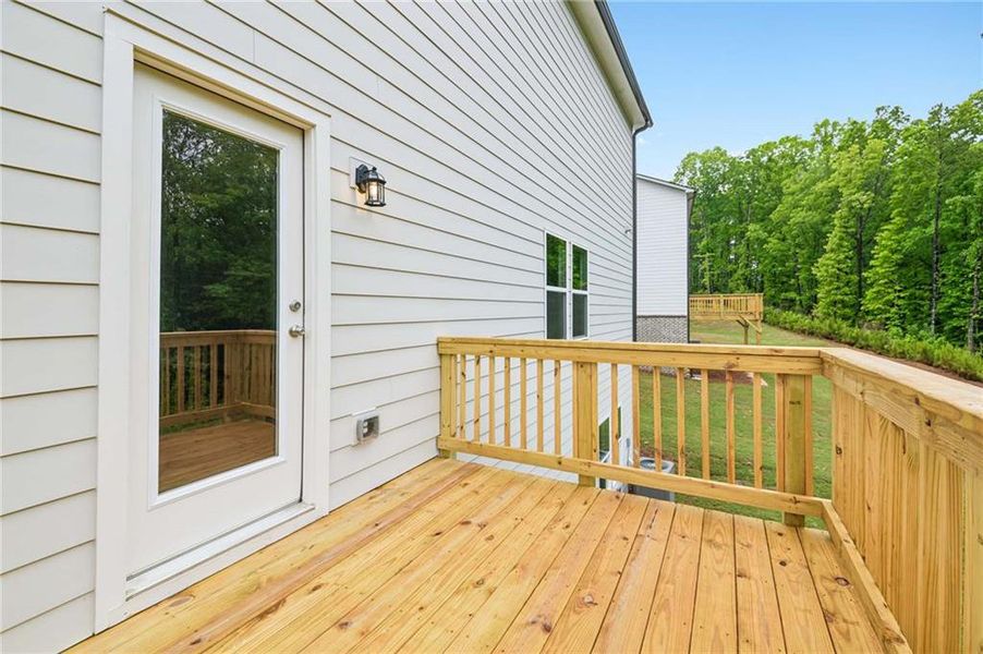 Exterior details and patio area of a home in The Pointe at Heron Bay, Locust Grove (Image 21).