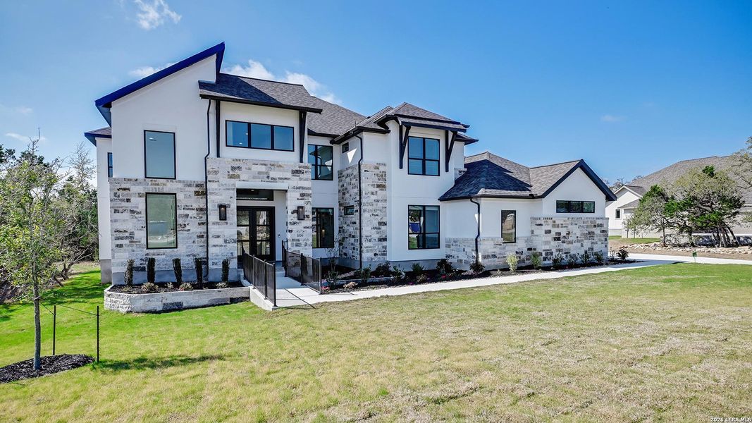 Front exterior of a new home in Thornebrook, Bulverde, TX, highlighting curb appeal (Image 21).
