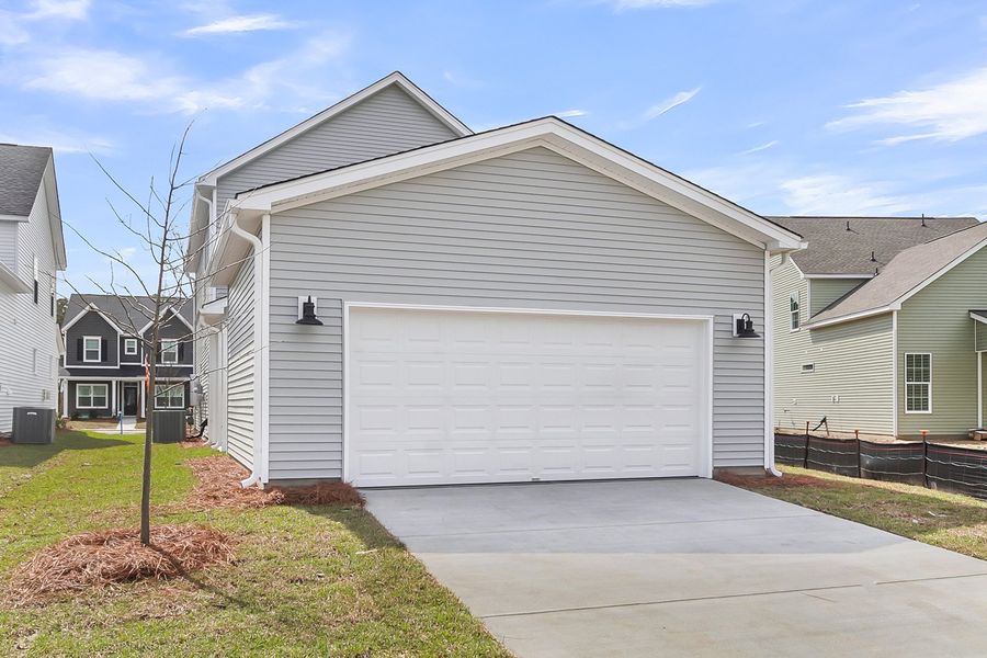 Front exterior of a new home in Six Oaks, Summerville, SC, highlighting curb appeal (Image 22).