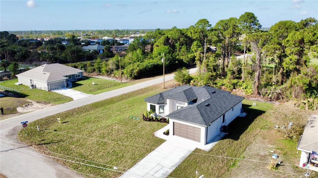 Front exterior of a new home in , Lehigh Acres, FL, highlighting curb appeal (Image 23).