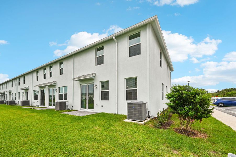 Front exterior of a new home in Tidewater, Fort Pierce, FL, highlighting curb appeal (Image 19). Front exterior of a new home in Tidewater, Fort Pierce, FL, highlighting curb appeal (Image 19).