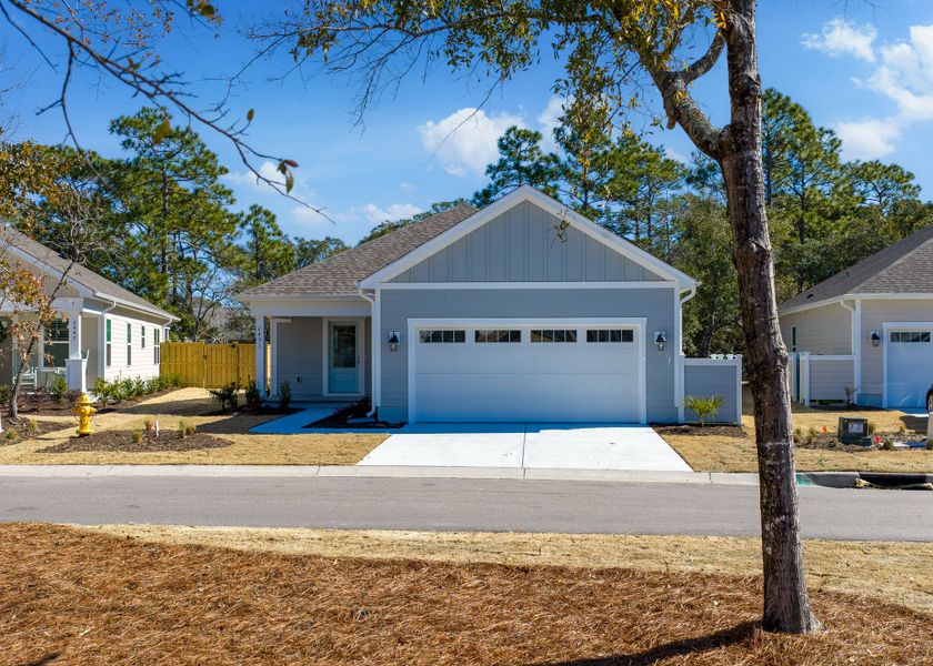 Front exterior of a new home in Osprey Landing, Southport, NC, highlighting curb appeal (Image 27).