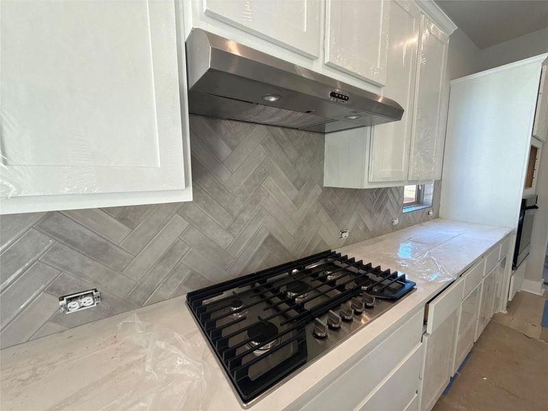 Gorgeous Kitchen detailing with built-in gas range