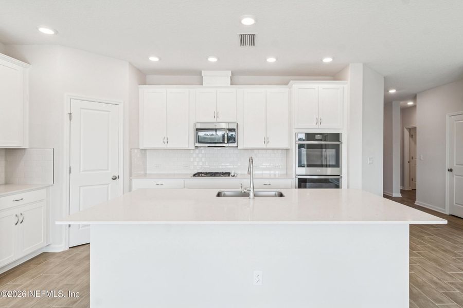 Furnished interior view inside a new home in Tributary 50', Yulee (Image 9).