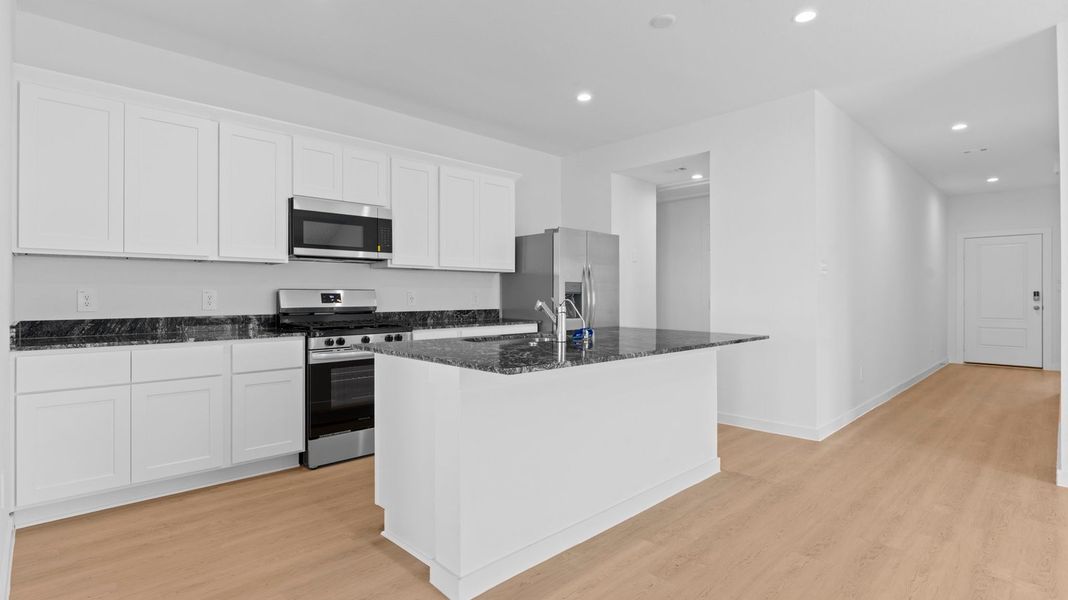Representative furnished interior of a home built from the Caden by D.R. Horton in Caldwell Crossing, Iowa Colony (Image 4).