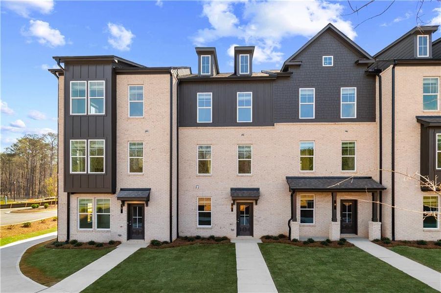 Front exterior of a new home in Daybreak, Newnan, GA, highlighting curb appeal (Image 23). Front exterior of a new home in Daybreak, Newnan, GA, highlighting curb appeal (Image 23).