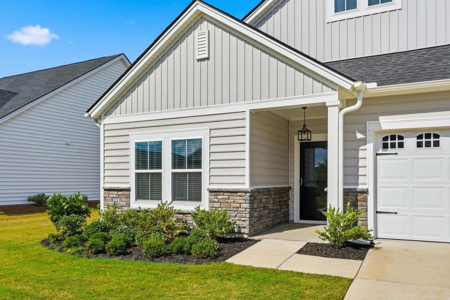 Exterior details and patio area of a home in Horizons at Summers Corner | 55+, Summerville (Image 32).