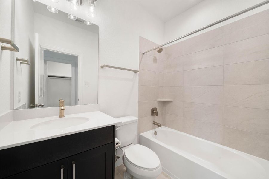 Fourth full sized bathroom attached to the fourth bedroom.