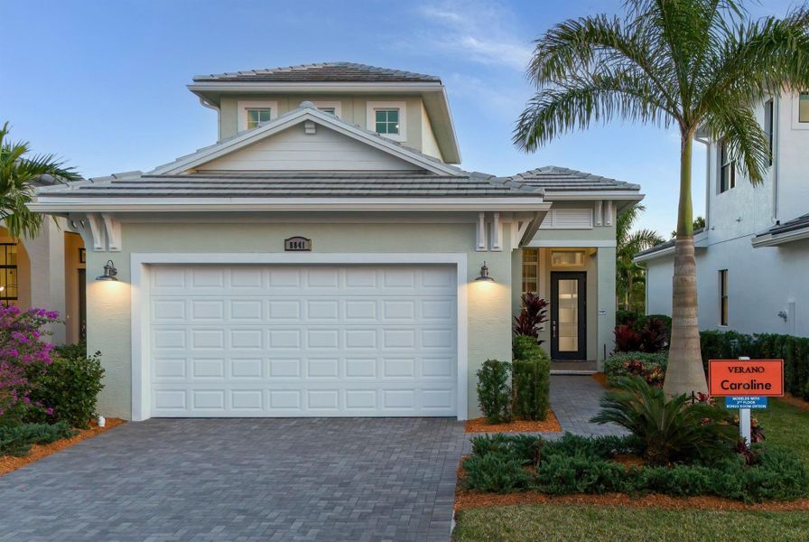 Front exterior of a new home in PGA Village Verano, Port St. Lucie, FL, highlighting curb appeal (Image 1).