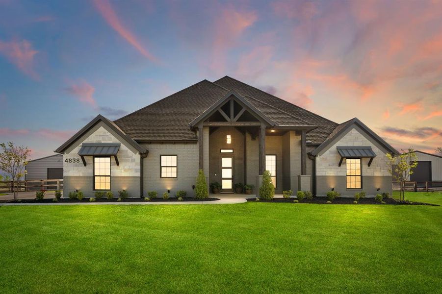 View of front of house featuring brick siding