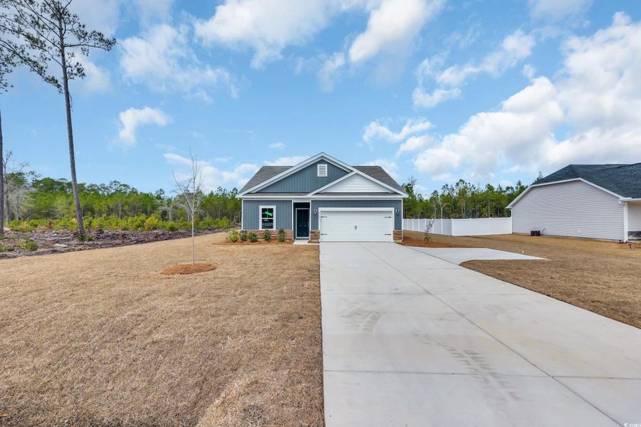 Front exterior of a new home in Beach Gardens, Conway, SC, highlighting curb appeal (Image 2). Front exterior of a new home in Beach Gardens, Conway, SC, highlighting curb appeal (Image 2).