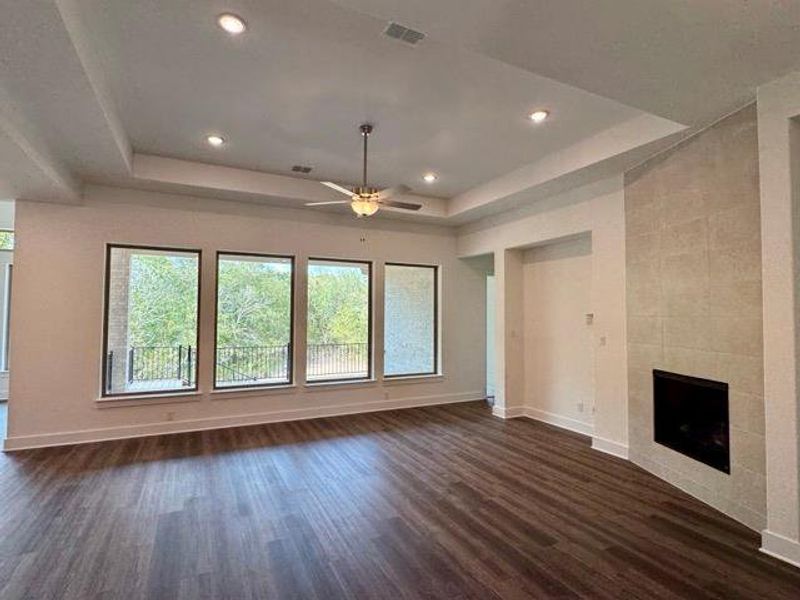 Family Room with tray ceiling and fireplace