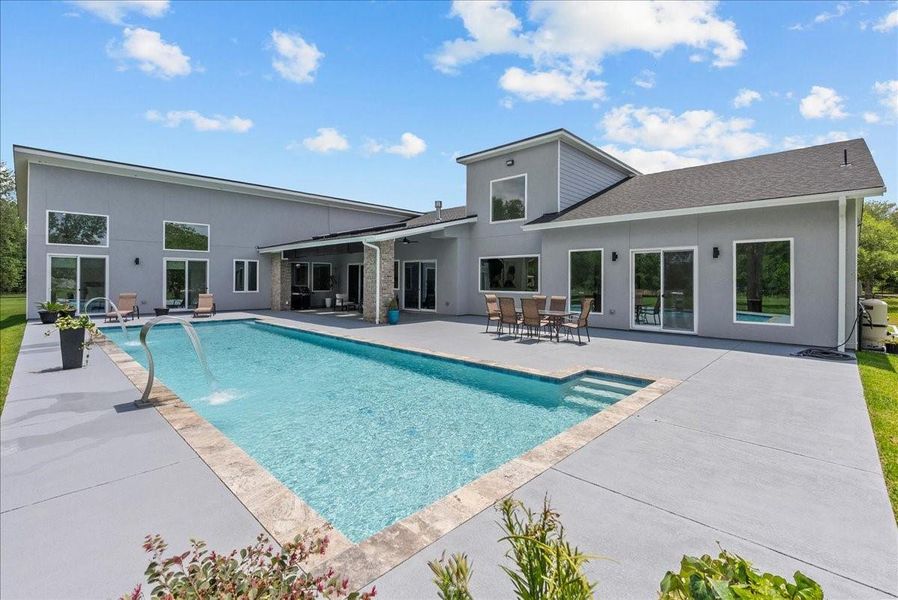 The massive 50’ x 20’ swimming pool serves as the centerpiece of this property.