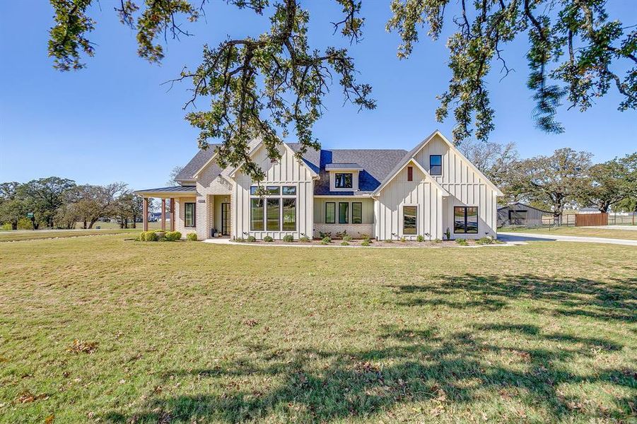 Front exterior of a new home in , Weatherford, TX, highlighting curb appeal (Image 2).