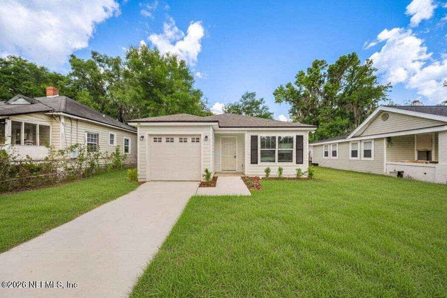 Front exterior of a new home in , Jacksonville, FL, highlighting curb appeal (Image 23).