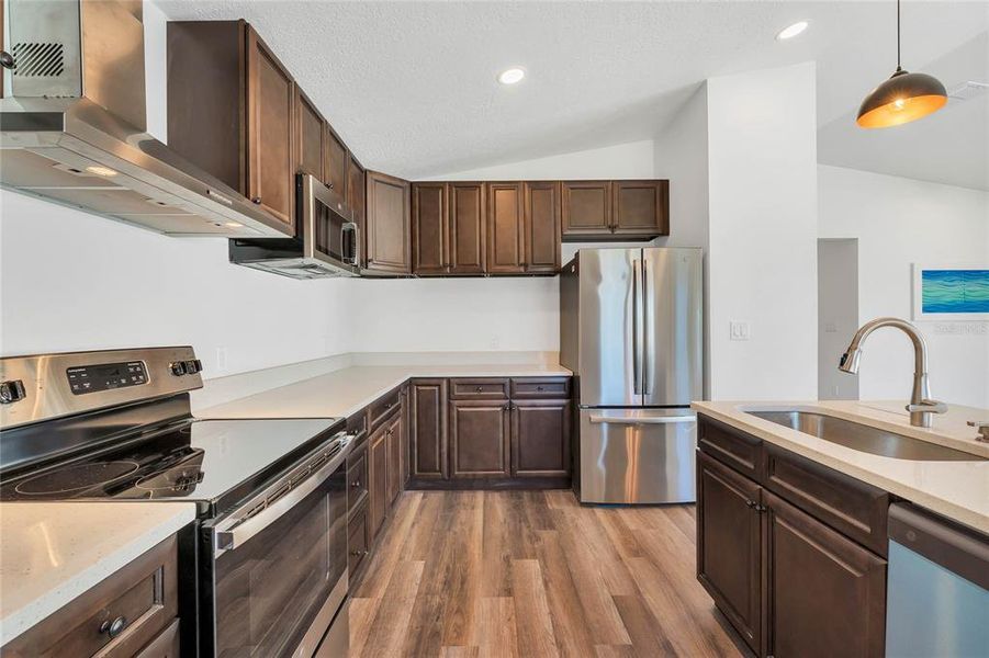 Kitchen w/ Island & Stainless Appliances