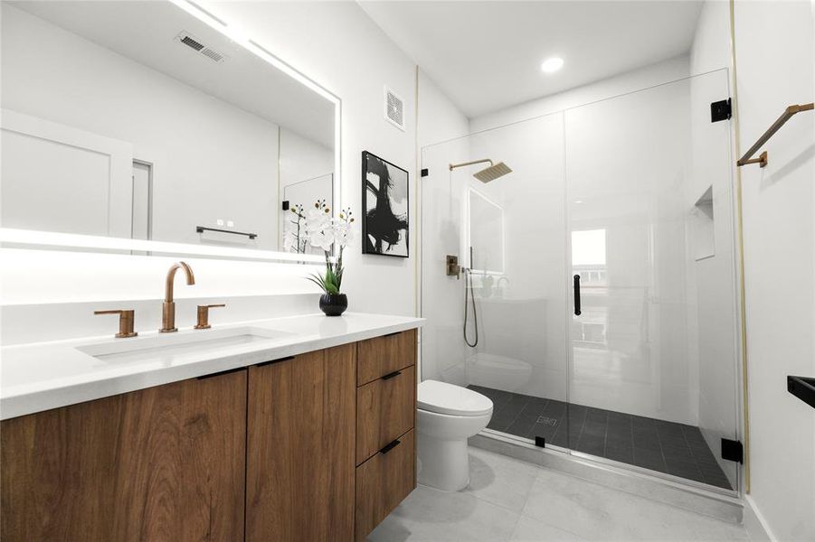 Bathroom featuring toilet, an enclosed shower, tile patterned floors, and vanity