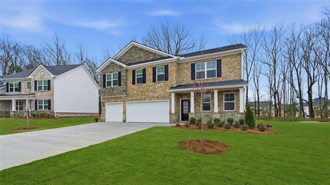 Front exterior of a new home in Independence, Loganville, GA, highlighting curb appeal (Image 1). Front exterior of a new home in Independence, Loganville, GA, highlighting curb appeal (Image 1).