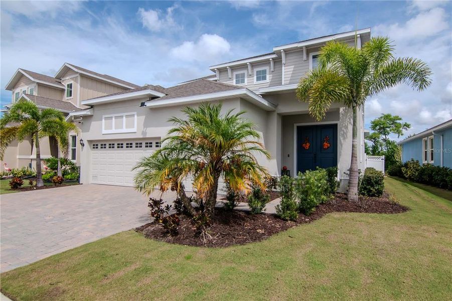 Front exterior of a new home in , Apollo Beach, FL, highlighting curb appeal (Image 19). Front exterior of a new home in , Apollo Beach, FL, highlighting curb appeal (Image 19).
