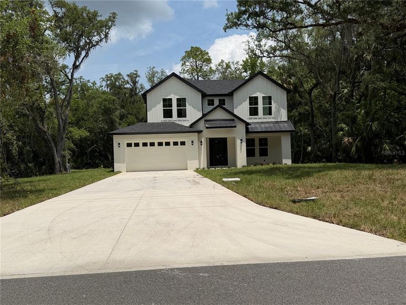Front exterior of a new home in , Geneva, FL, highlighting curb appeal (Image 18).