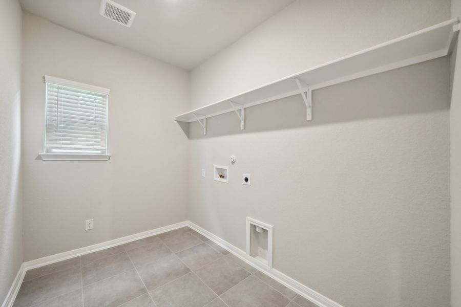 Laundry room in the Matador floorplan in the Meritage Homes community.