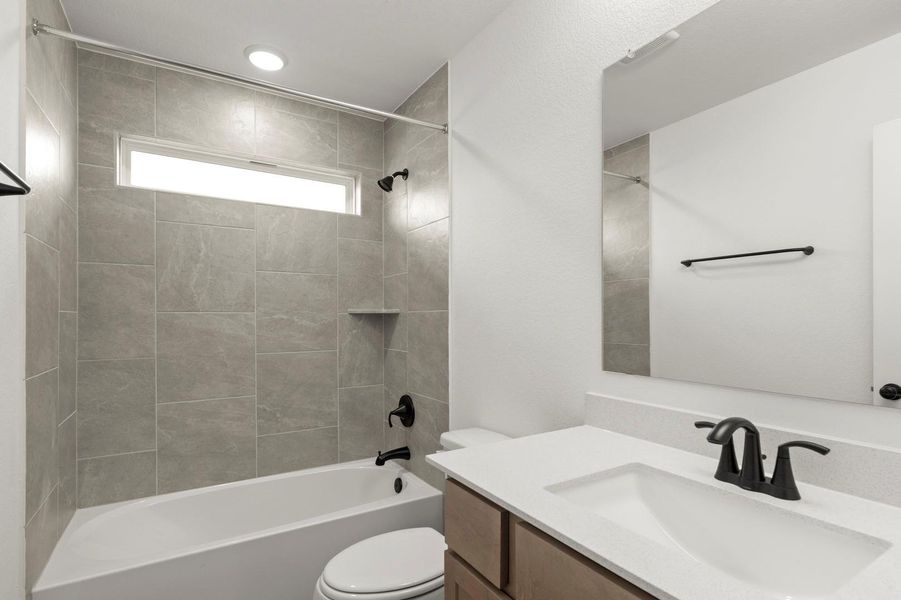 Full bath featuring bathtub / shower combination and vanity