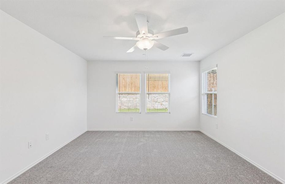 Elegant owner's suite with expansive windows