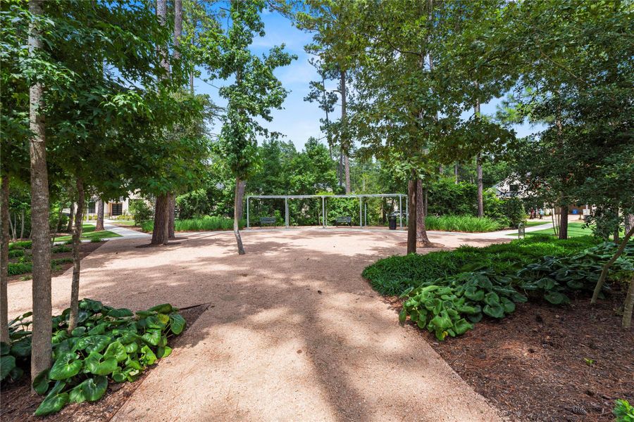 Tranquil and peaceful tree-lined trails just steps from the home.