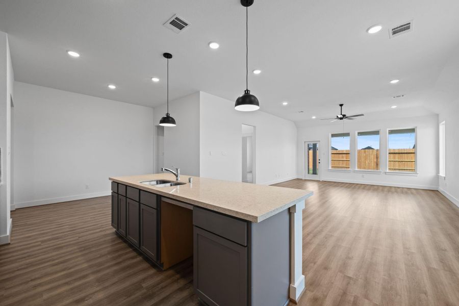 Picture cozy gatherings in a living area that encourages laughter, while the sleek kitchen—equipped with state-of-the-art appliances—beckons culinary adventures and family dinners.