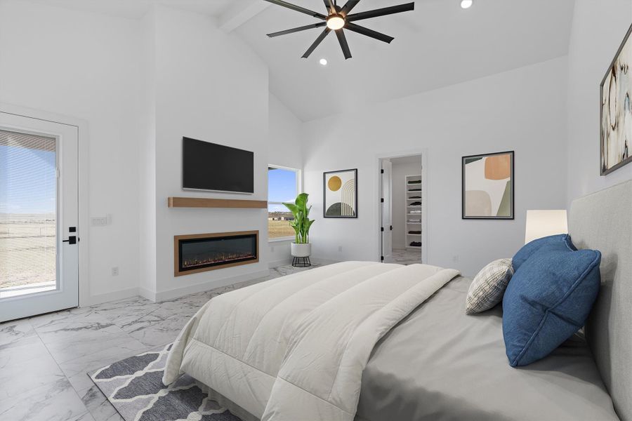 Unwind in this serene primary bedroom, featuring high ceilings and a modern fireplace. Unwind in this serene primary bedroom, featuring high ceilings and a modern fireplace.